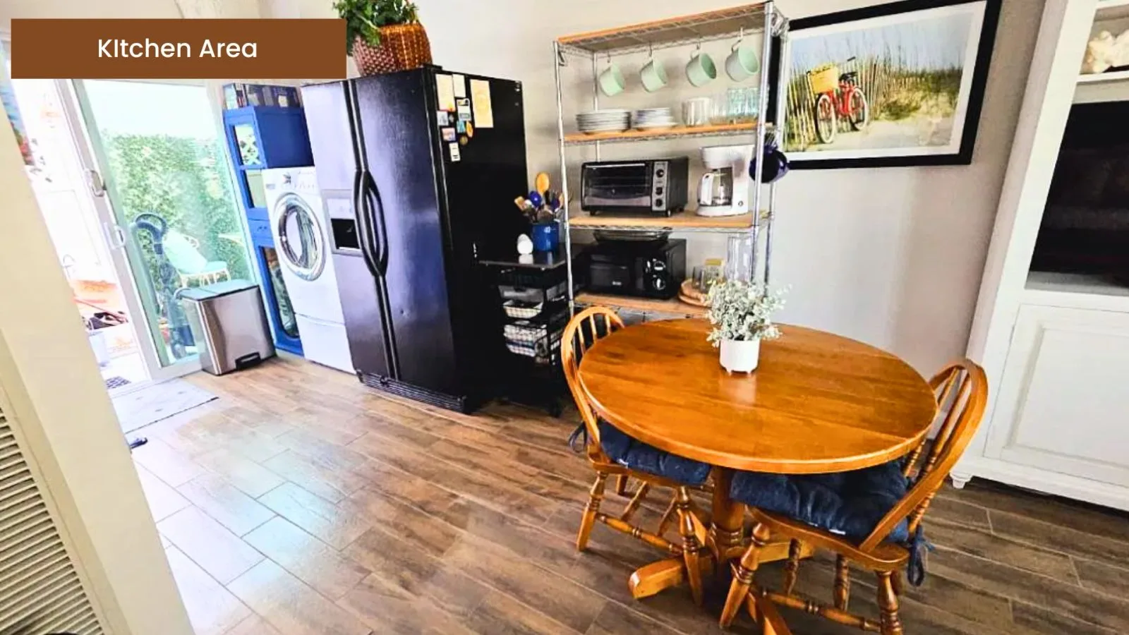 Kitchen and dining area with a round wood table