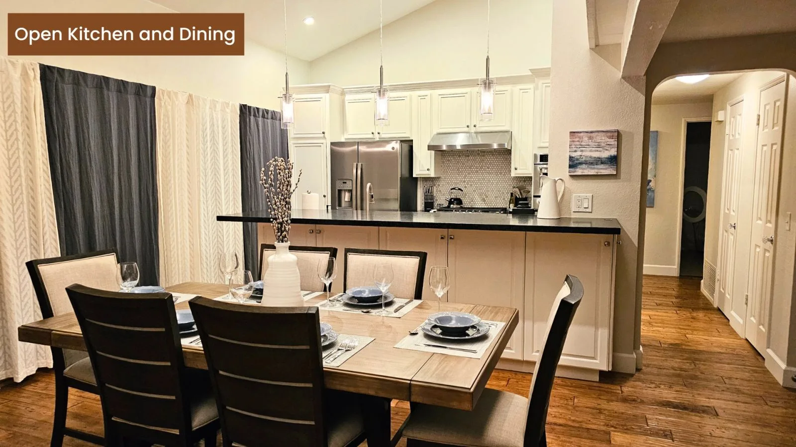 Open kitchen and dining area set for six