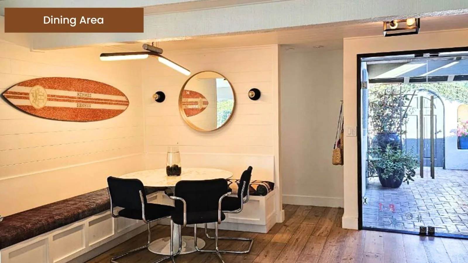 Living area of Esplanade House II with white oak hardwood floors and designer furnishings