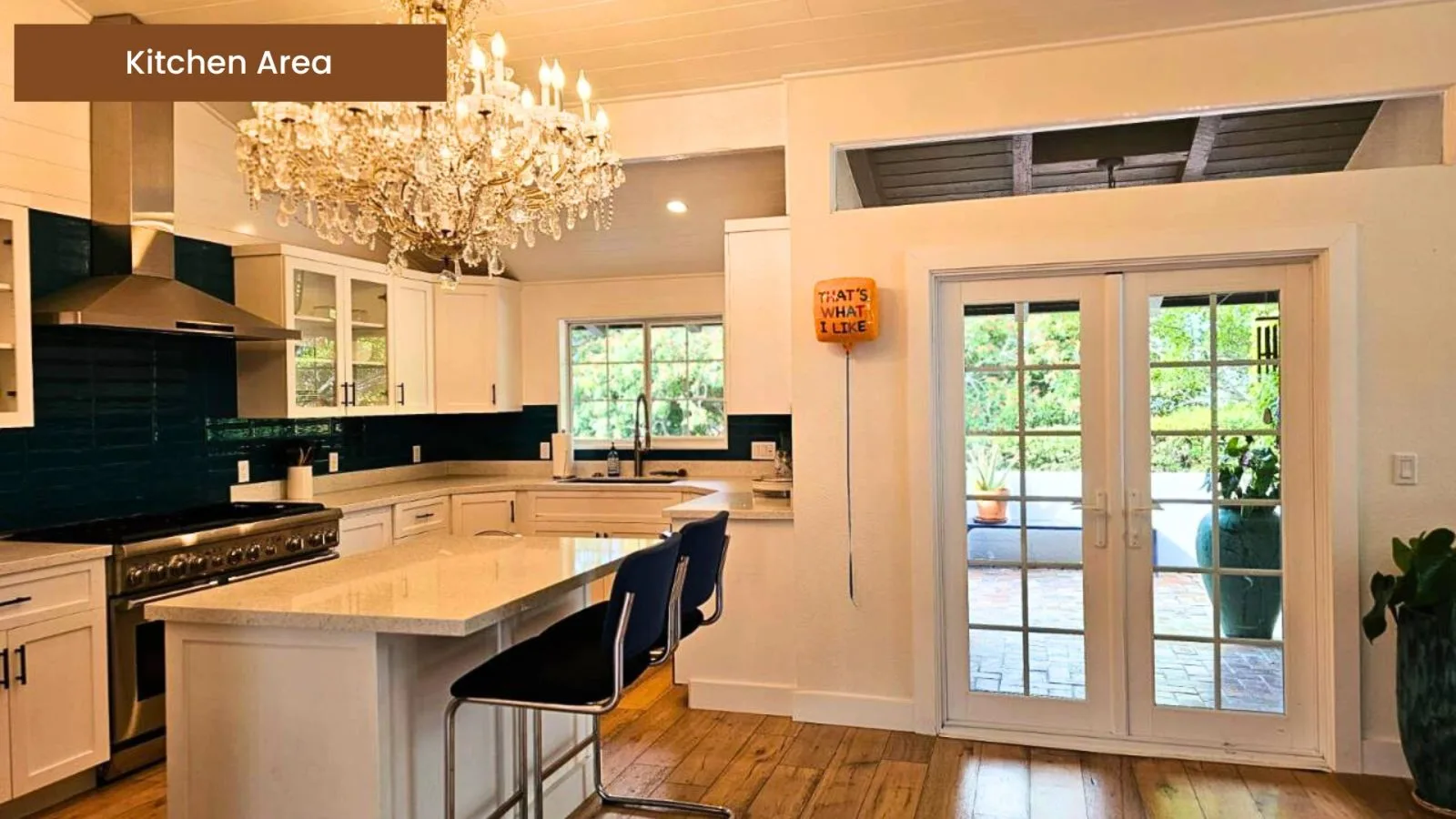Kitchen opening through French doors to the outdoors