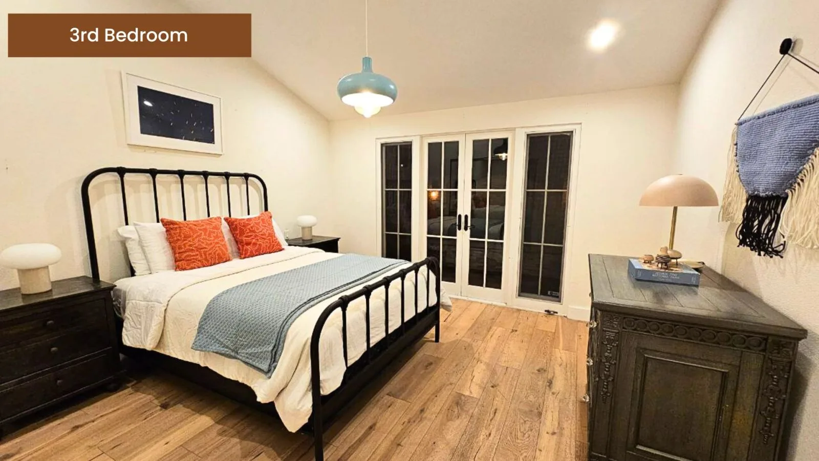 Third bedroom with a black iron bed frame