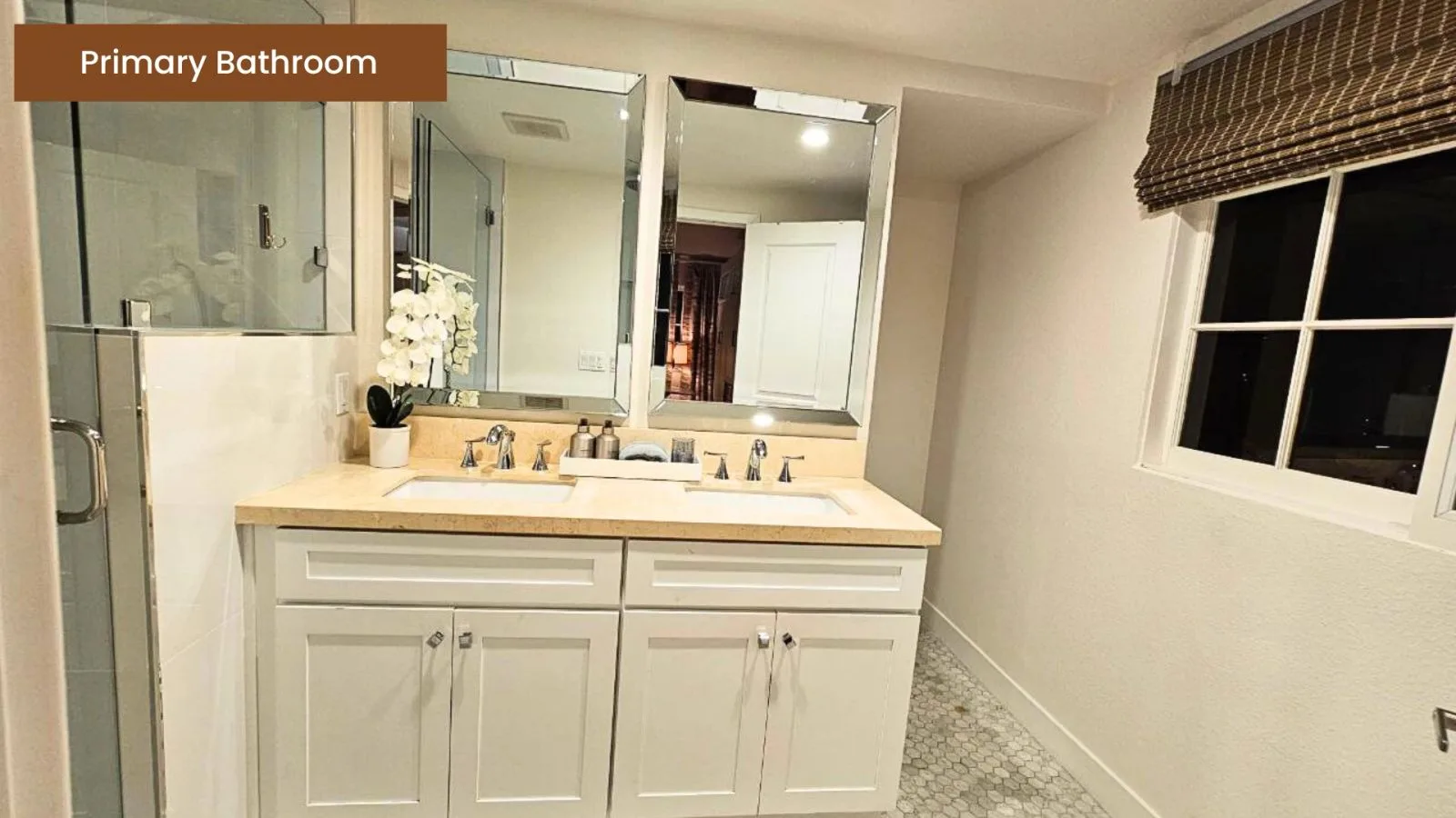Primary bathroom with dual vanities