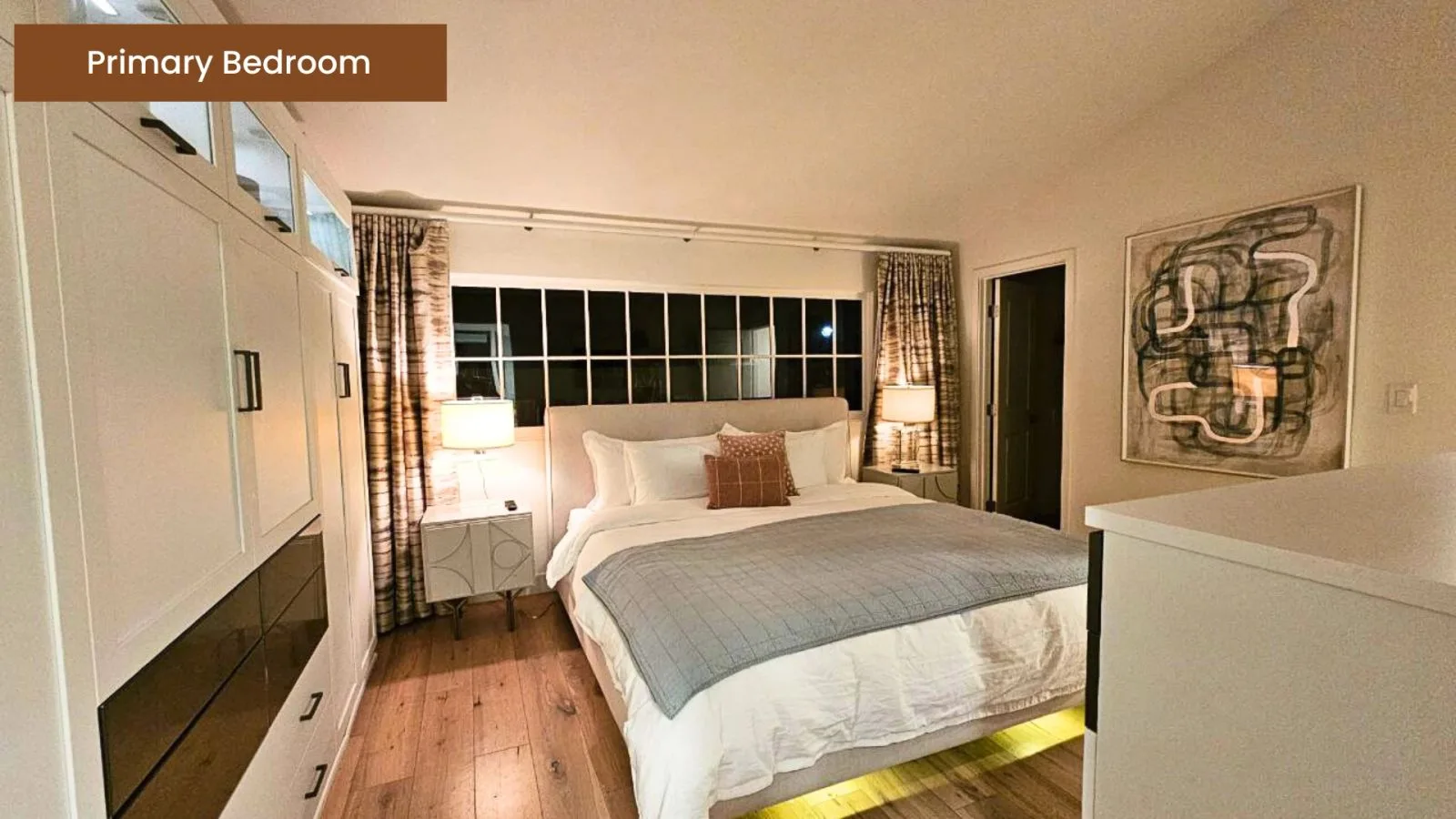 Primary bedroom with a king bed and garden windows